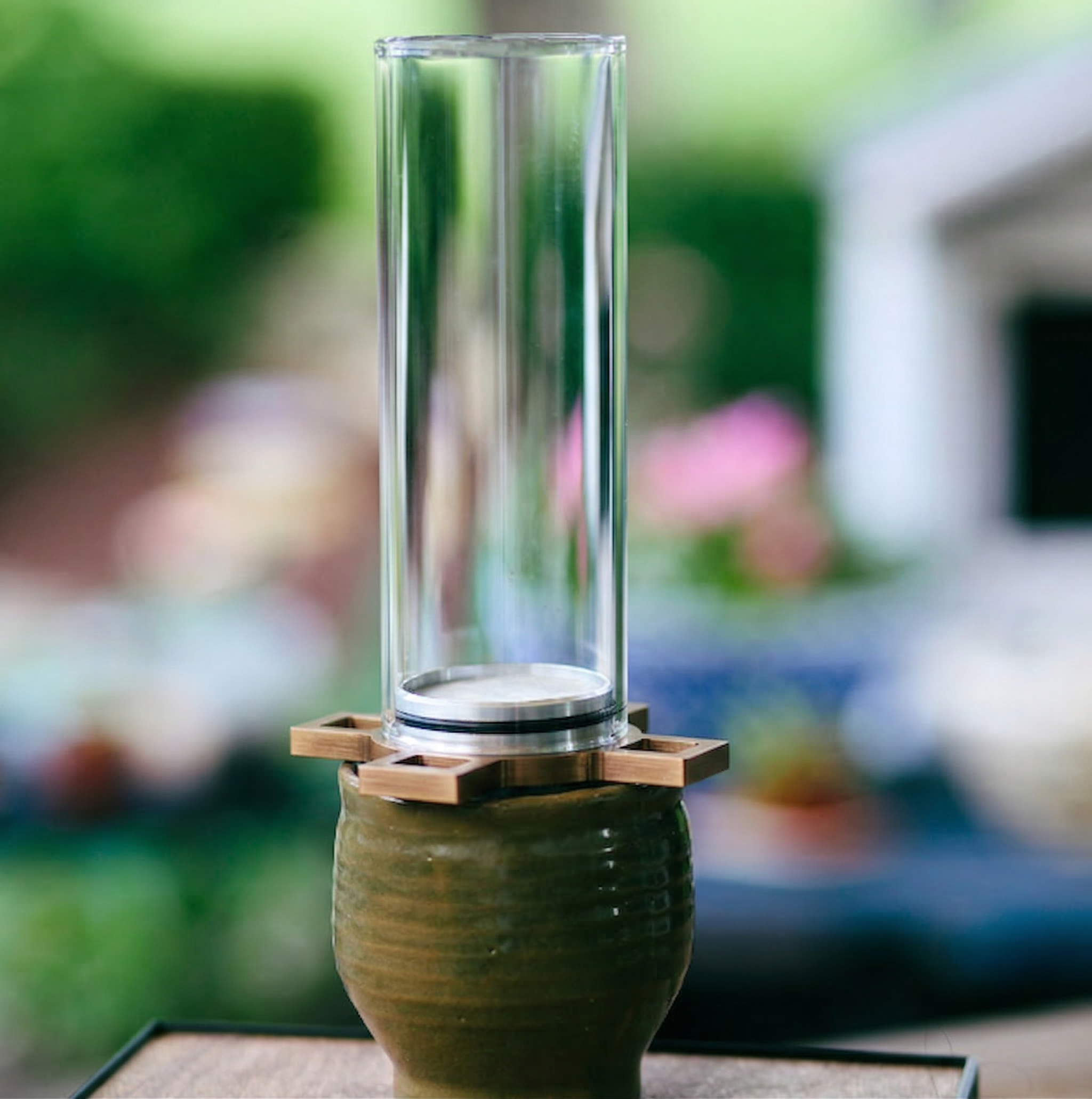 Bespoke Coffee Pour Over side view on ceramic cup in garden setting